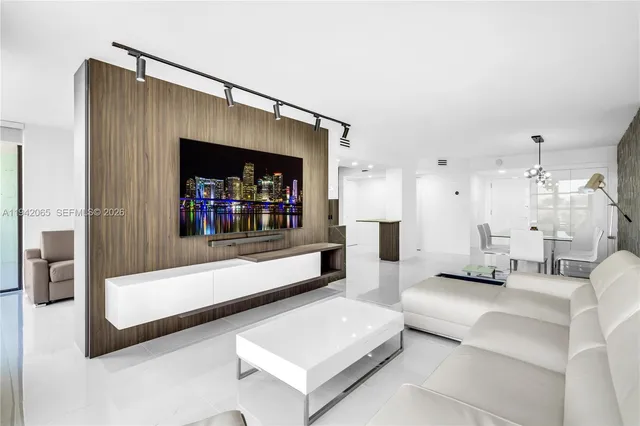 a living room with furniture and a mirror