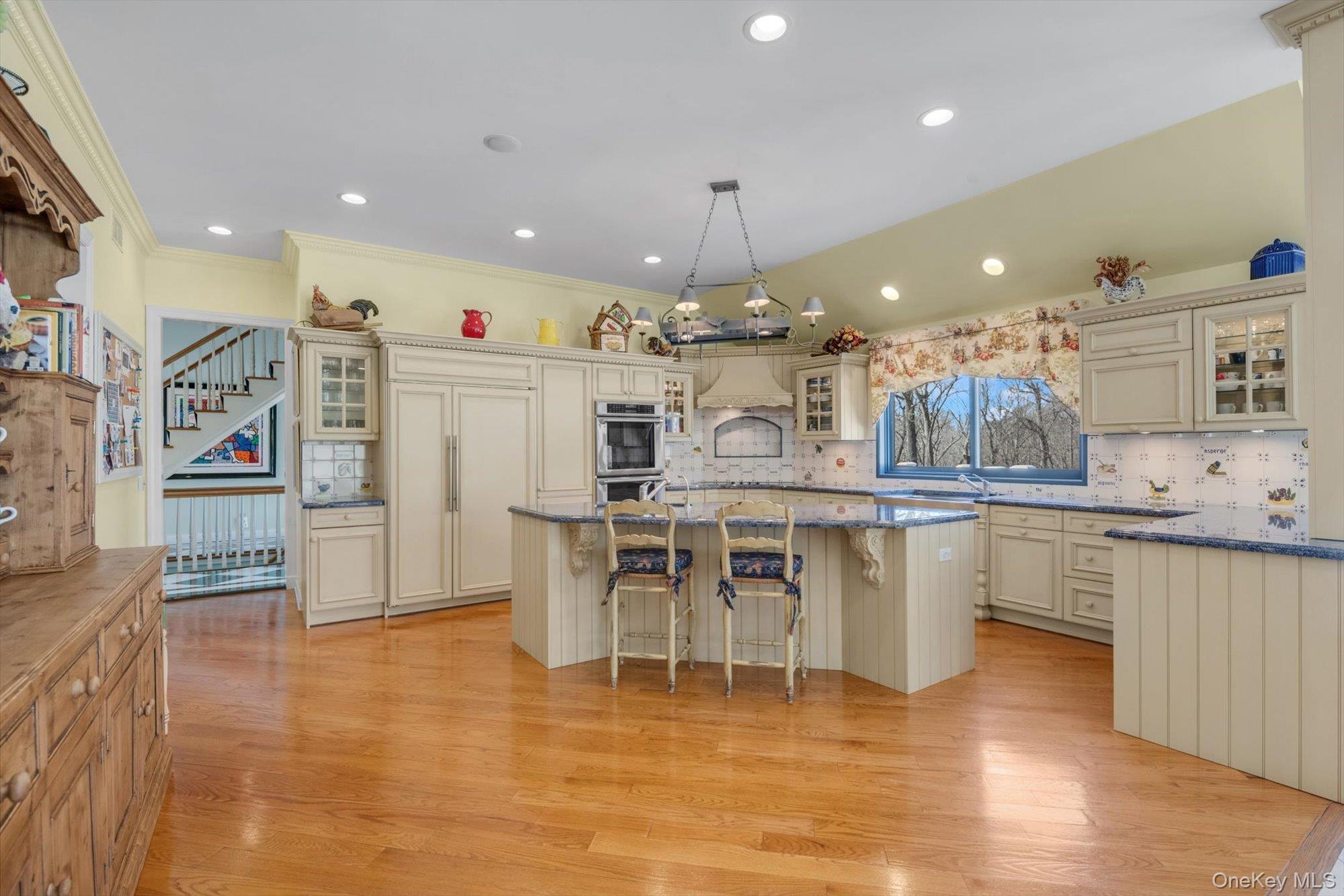 12 Overlook Court Locust Valley, NY 11560 - Photo 12 of 49 a kitchen with stainless steel appliances granite countertop a refrigerator a stove top oven and a sink with cabinets