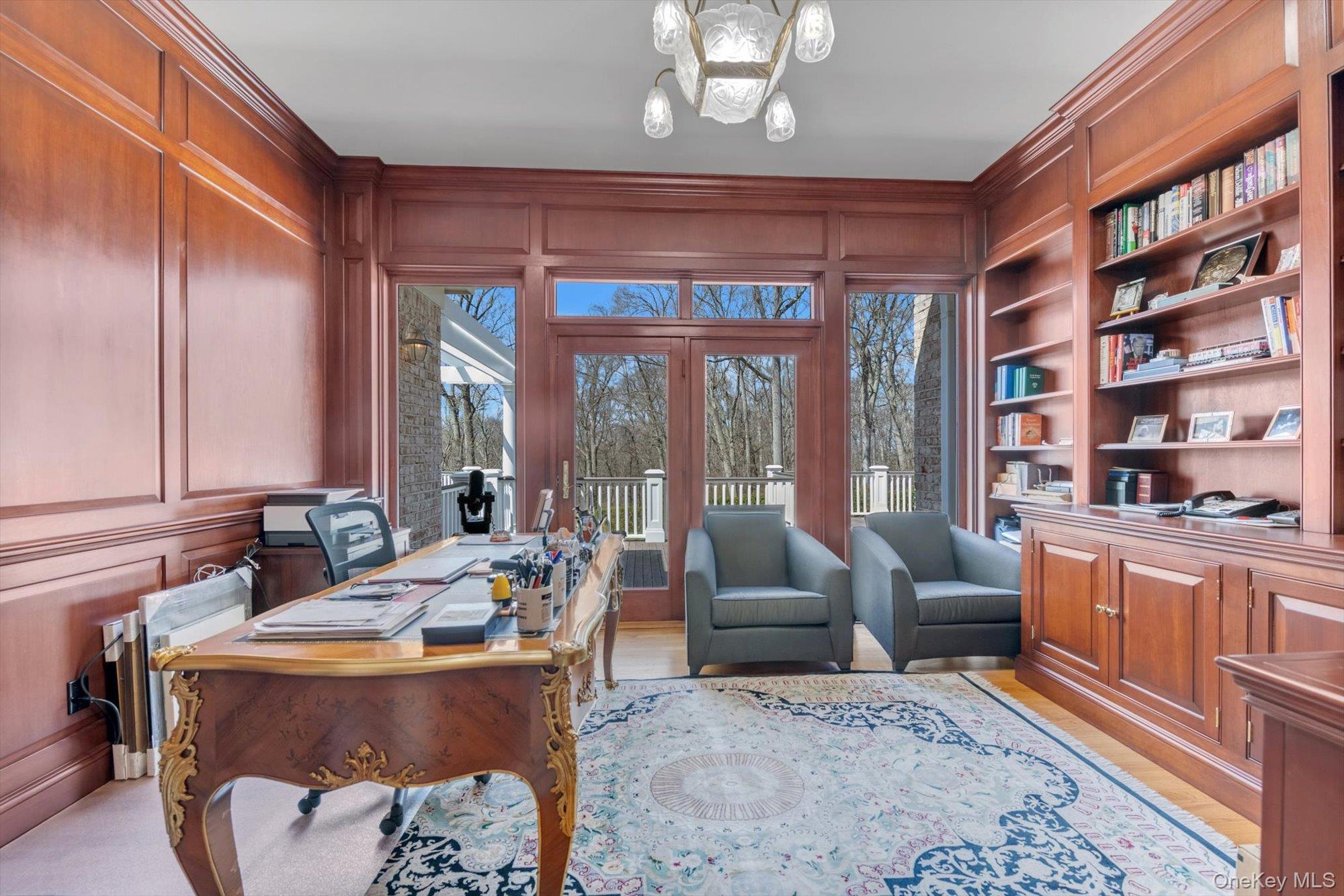 12 Overlook Court Locust Valley, NY 11560 - Photo 18 of 49 a living room with furniture potted plant and a large window