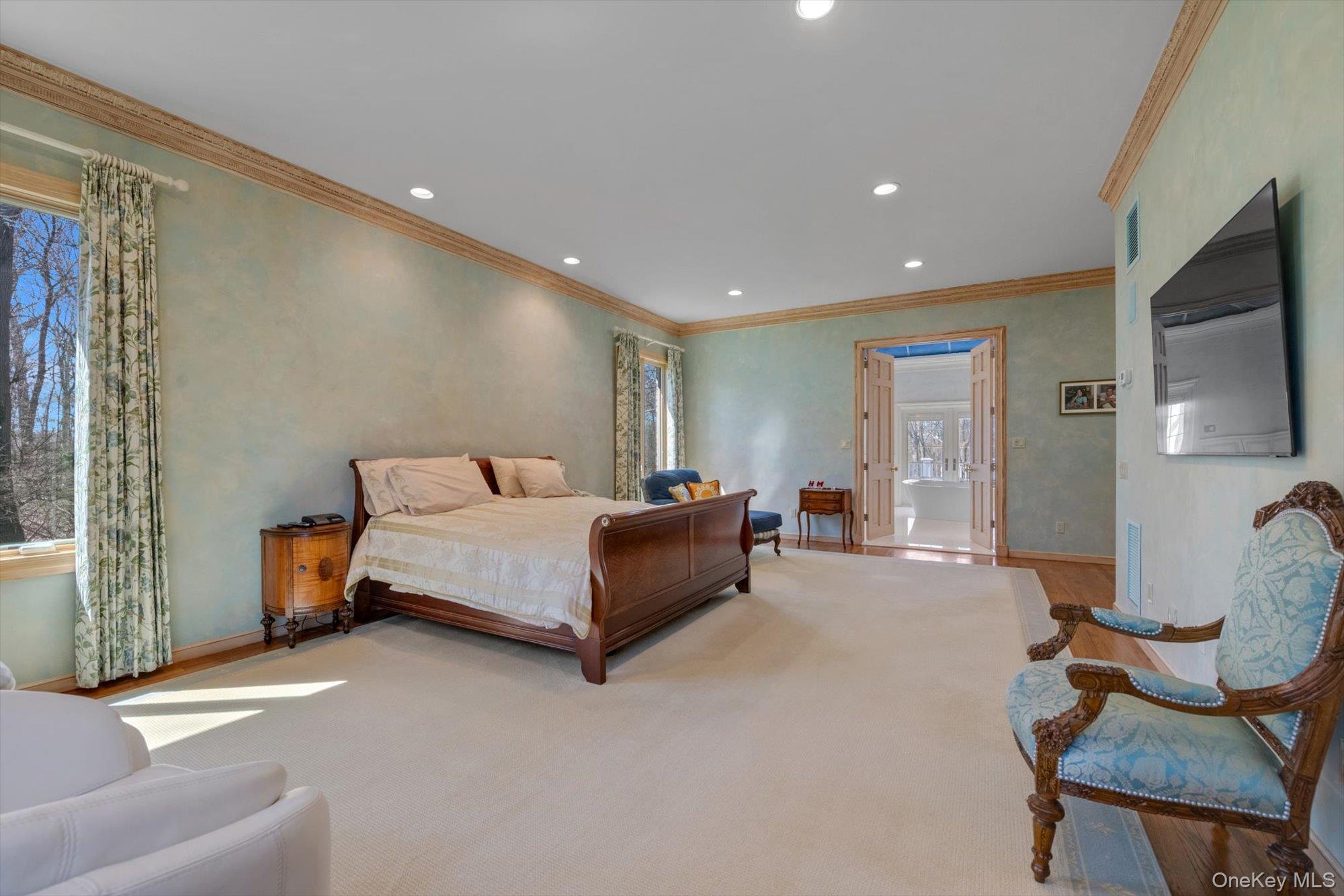 12 Overlook Court Locust Valley, NY 11560 - Photo 20 of 49 a spacious bedroom with a bed and furniture