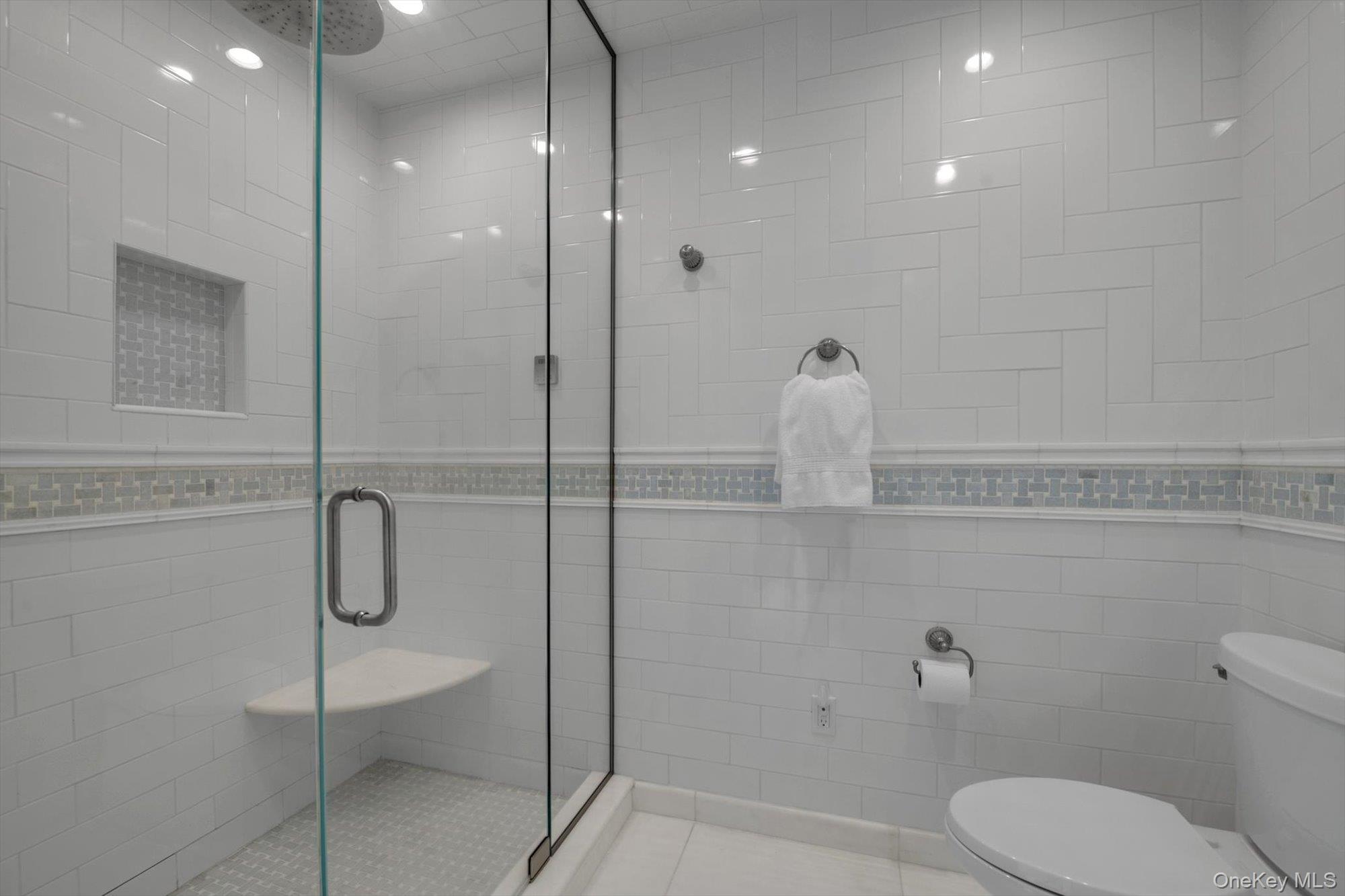 12 Overlook Court Locust Valley, NY 11560 - Photo 24 of 49 a bathroom with a shower and toilet
