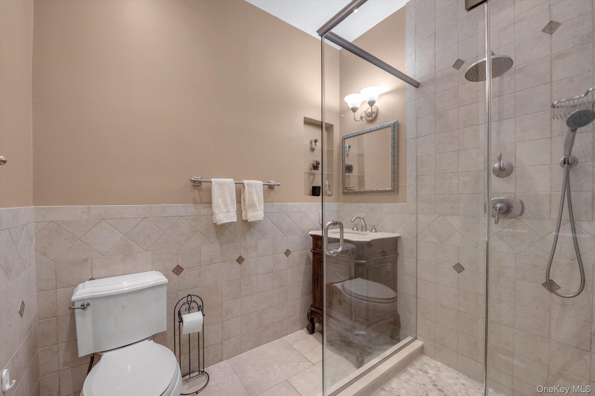 12 Overlook Court Locust Valley, NY 11560 - Photo 34 of 49 a bathroom with a granite countertop shower a toilet and sink