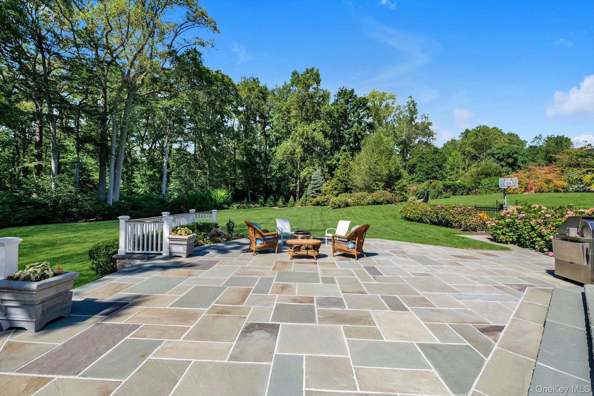 12 Overlook Court Locust Valley, NY 11560 - Photo 43 of 49 a view of a backyard with sitting area