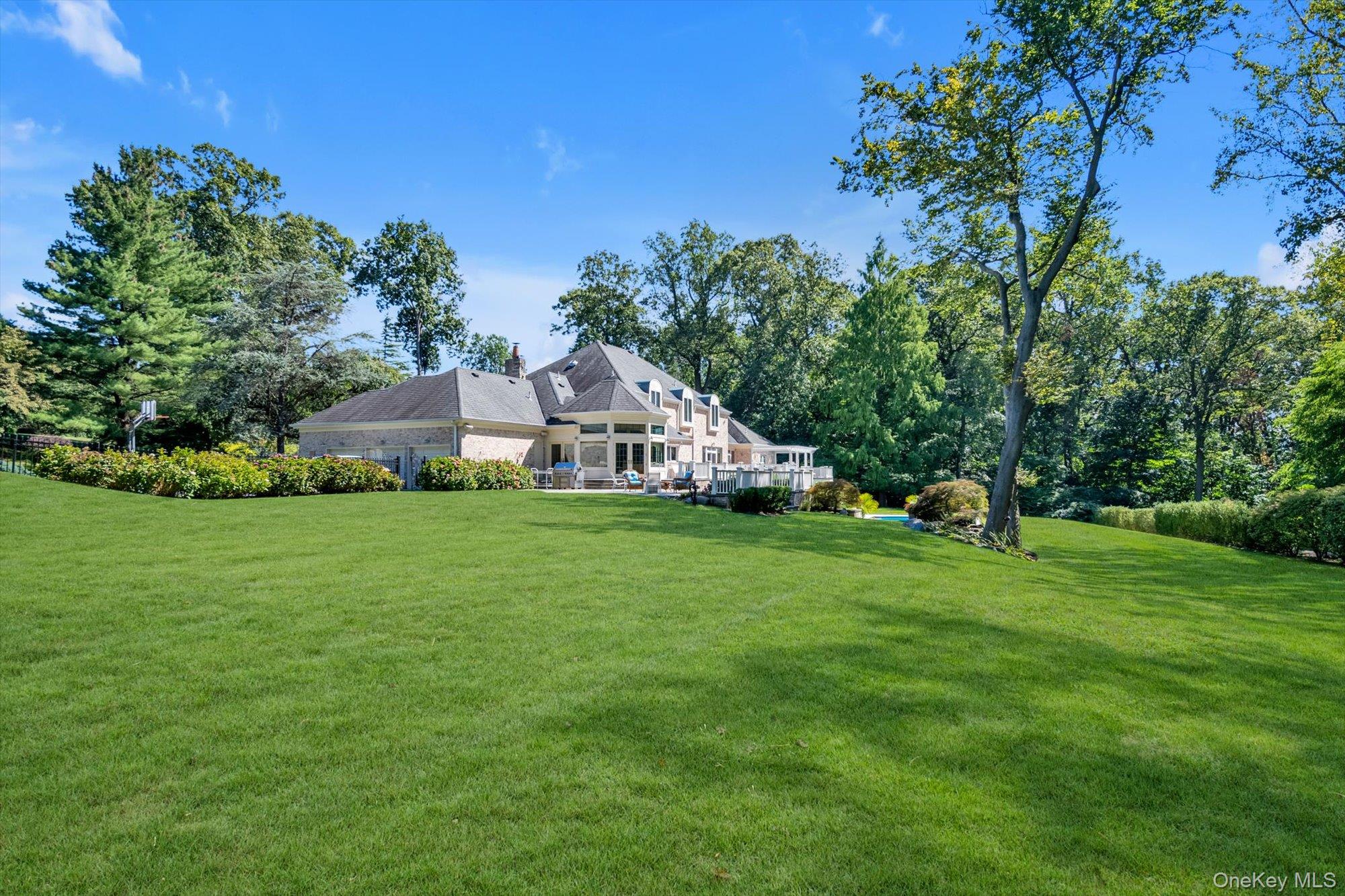 12 Overlook Court Locust Valley, NY 11560 - Photo 49 of 49 a view of an house with backyard space and garden