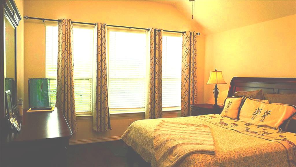 1907 Edgecreek Path Lewisville, TX 75010 - Photo 3 of 10 a bedroom with a bed and a window
