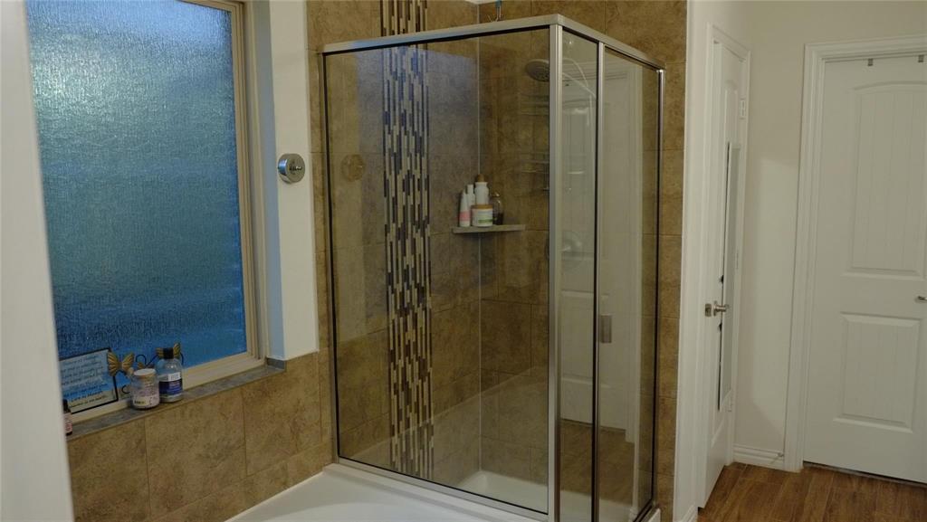 1907 Edgecreek Path Lewisville, TX 75010 - Photo 9 of 10 a bathroom with a shower and a sink