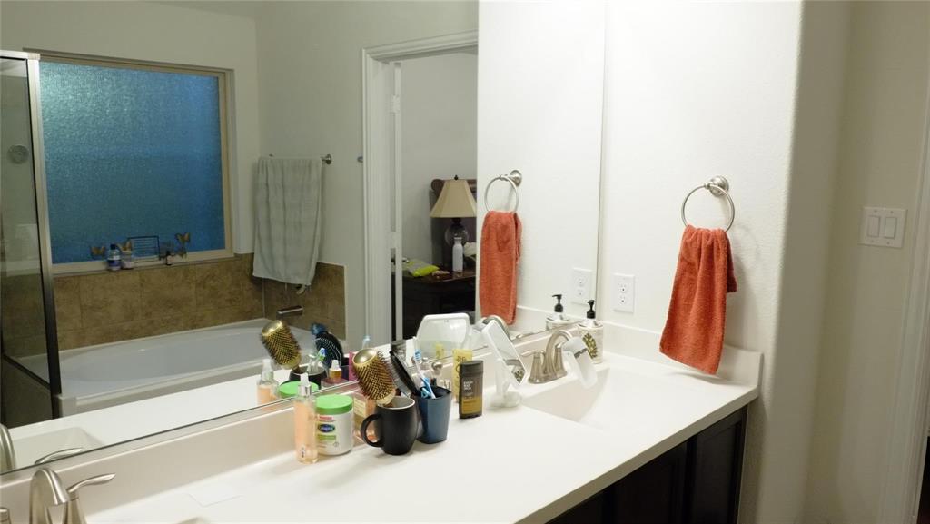 1907 Edgecreek Path Lewisville, TX 75010 - Photo 10 of 10 a bathroom with a sink tub and a mirror