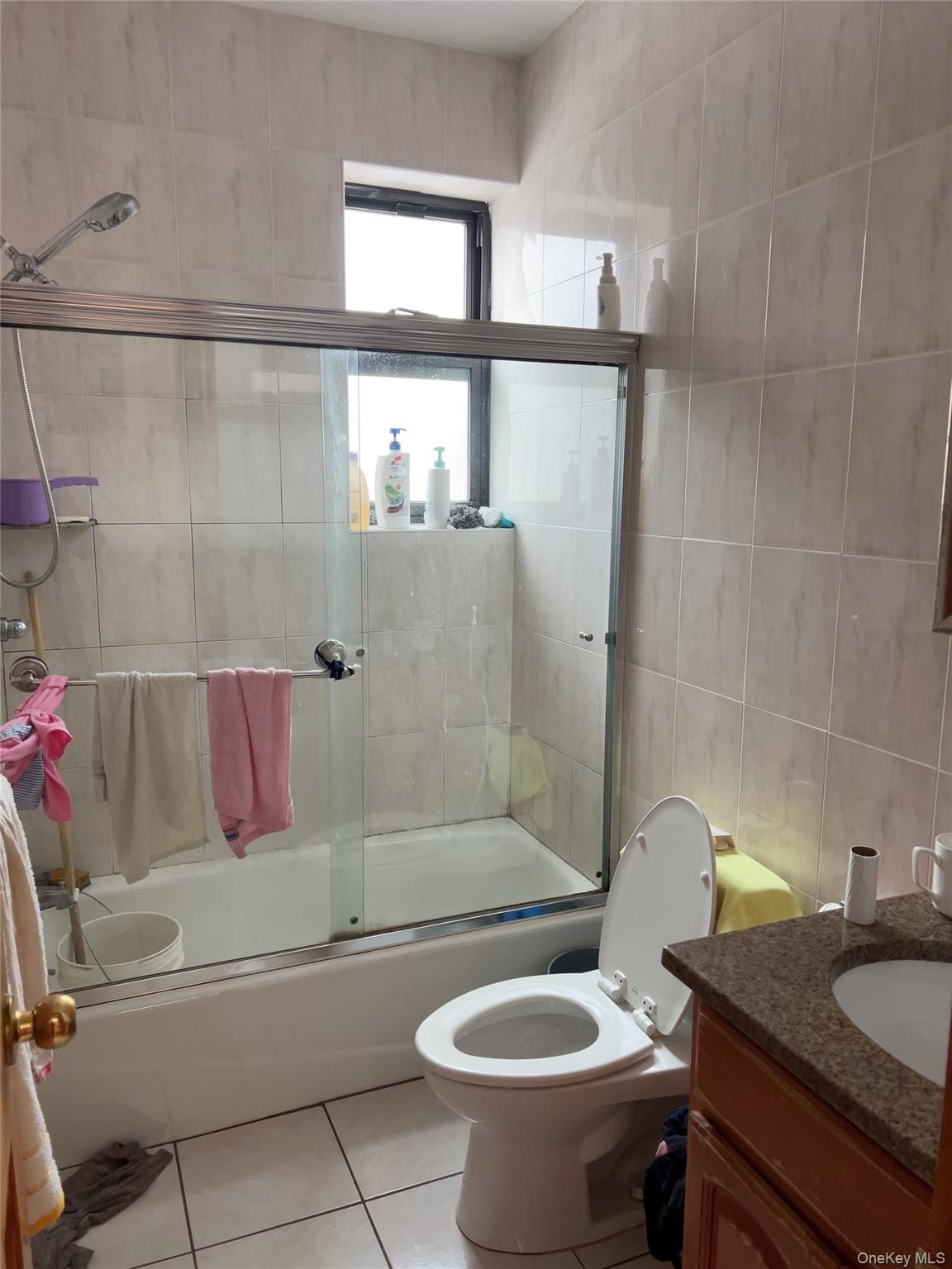 32-01 Junction Boulevard, Unit 4 Queens, NY 11369 - Photo 11 of 14 a bathroom with a granite countertop sink toilet and shower