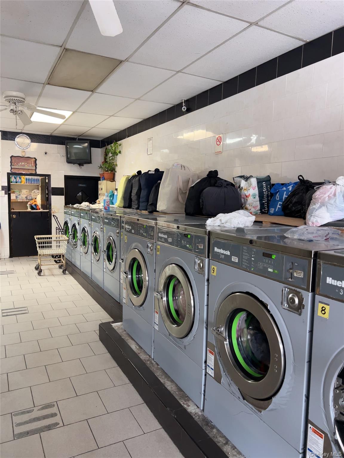 32-01 Junction Boulevard, Unit 4 Queens, NY 11369 - Photo 5 of 14 a utility room with dryer and washer