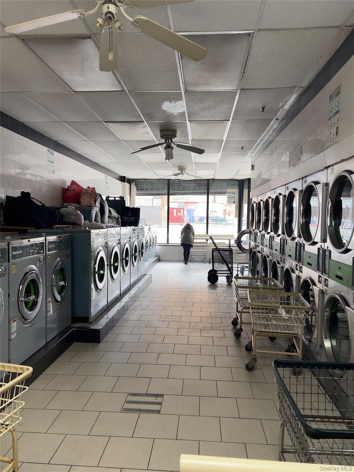 32-01 Junction Boulevard, Unit 4 Queens, NY 11369 - Photo 6 of 14 a view of a storage room with washer and dryer