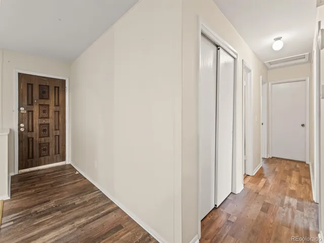 a bathroom with a sink a toilet a mirror and shower