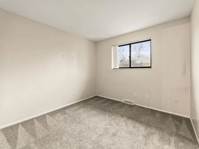 a view of house with a yard