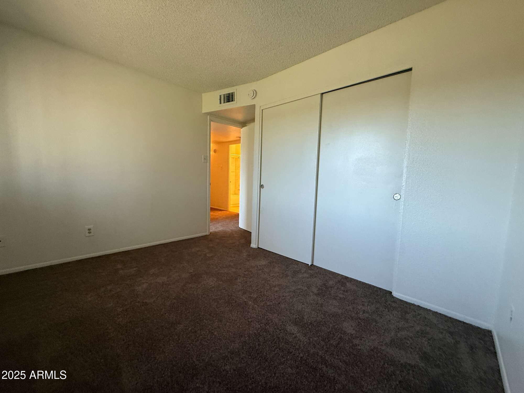 3947 West Wonderview Road Phoenix, AZ 85019 - Photo 13 of 16 a view of an empty room