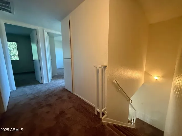 a bathroom with a toilet a sink a mirror and bathtub