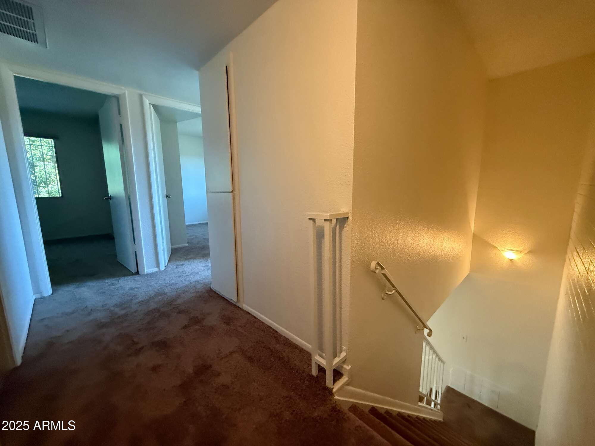 3947 West Wonderview Road Phoenix, AZ 85019 - Photo 8 of 16 a view of a livingroom from a hallway