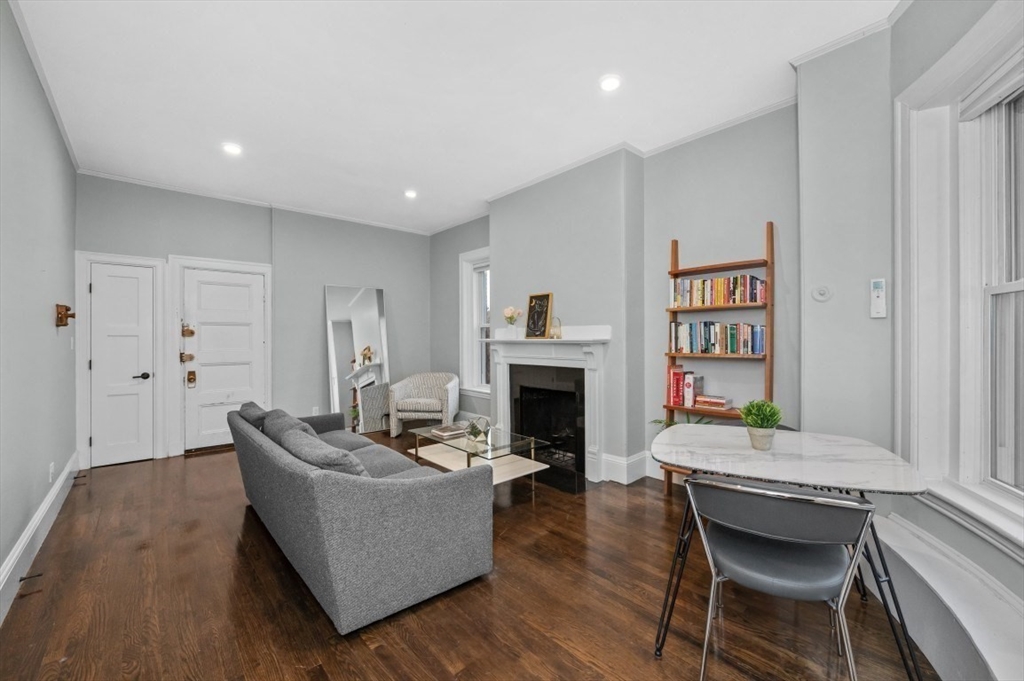 1880 Beacon Street, Unit 6 Brookline, MA 02445 - Photo 2 of 18 a living room with furniture and a fireplace