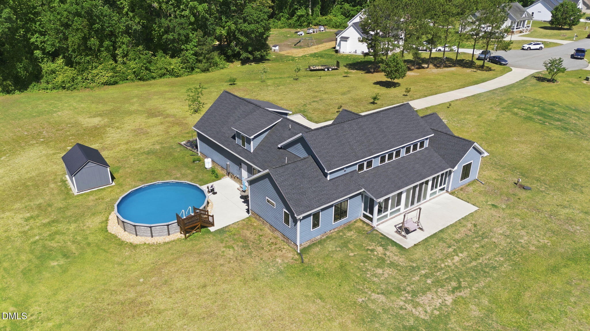 35 North Rippling Court Smithfield, NC 27577 - Photo 5 of 59 an aerial view of a house with swimming pool and green space