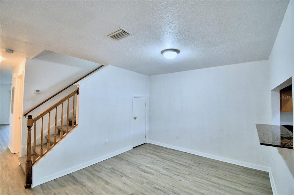 5359 River Rock Road Lakeland, FL 33809 - Photo 11 of 51 a view of an entryway with wooden floor