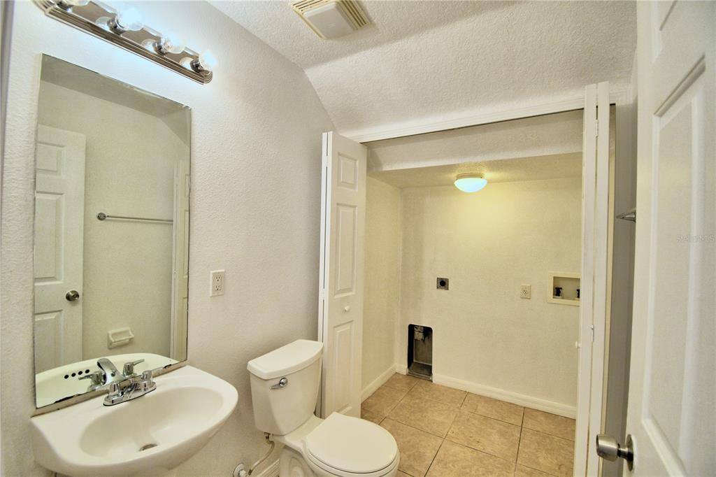 5359 River Rock Road Lakeland, FL 33809 - Photo 16 of 51 a bathroom with a sink toilet and shower