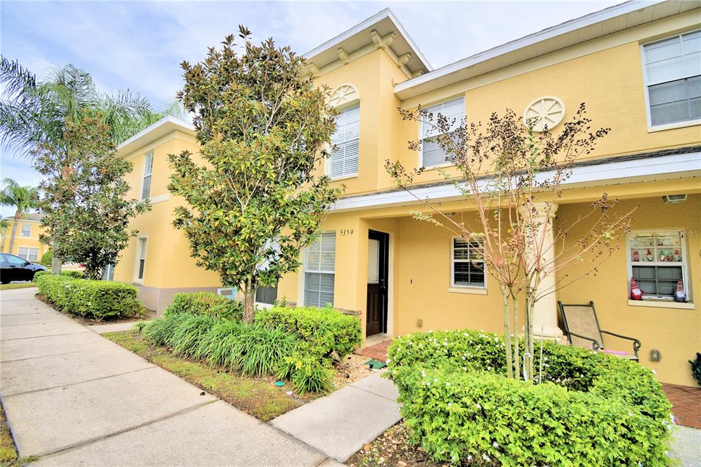 5359 River Rock Road Lakeland, FL 33809 - Photo 2 of 51 a front view of a house with a garden
