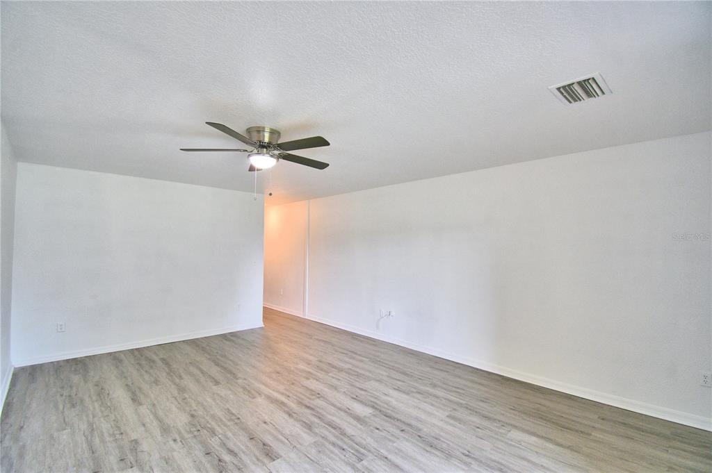 5359 River Rock Road Lakeland, FL 33809 - Photo 21 of 51 a view of a room with wooden floor