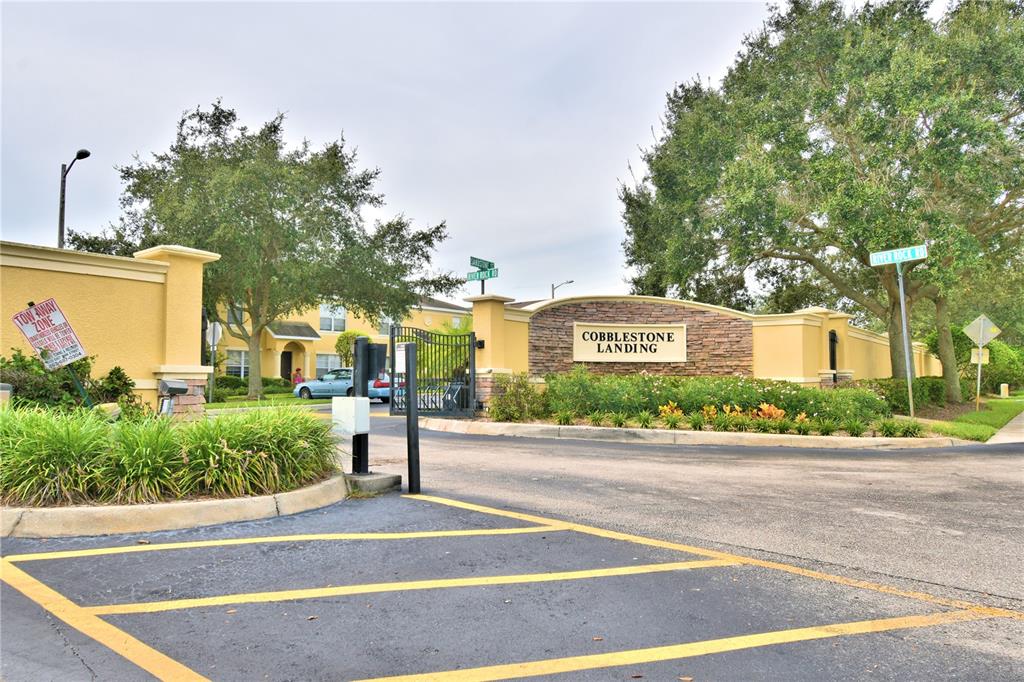 5359 River Rock Road Lakeland, FL 33809 - Photo 51 of 51 a view of a street with a building and trees in the background