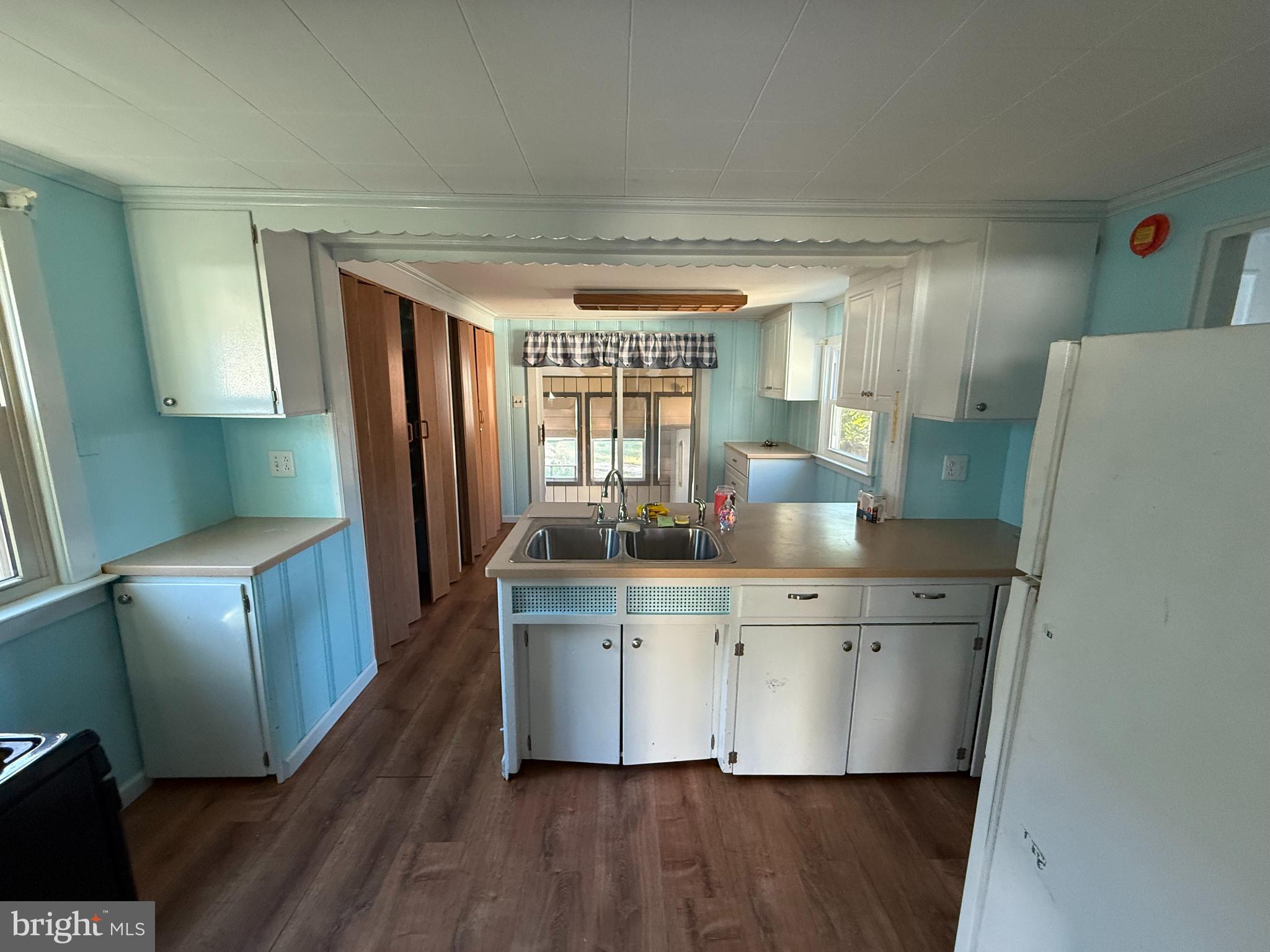 410 South Forklanding Road Maple Shade, NJ 08052 - Photo 8 of 13 a view of kitchen with cabinets and wooden floor