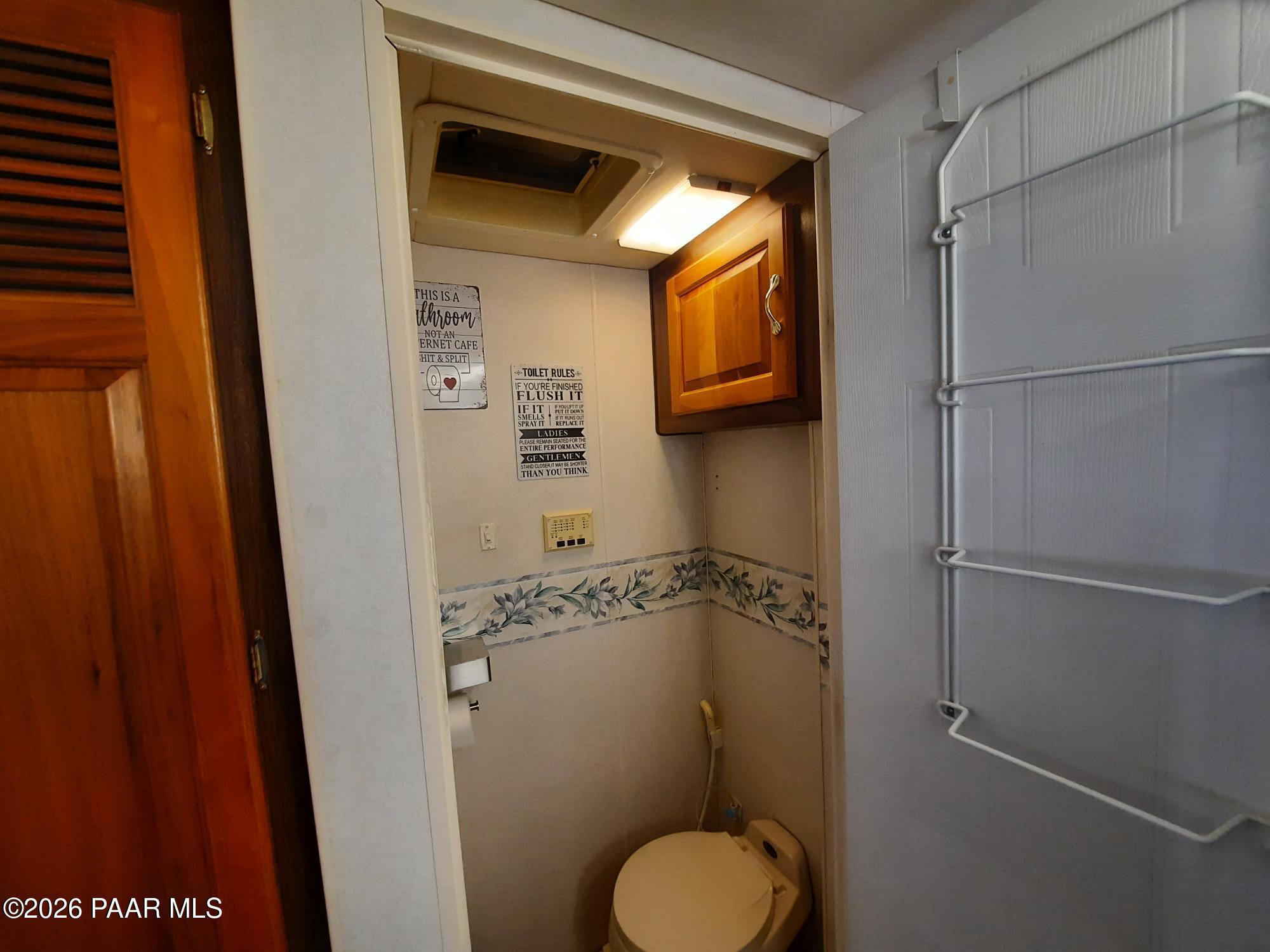 261 East W Titan Ranch Road Seligman, AZ 86337 - Photo 10 of 24 a bathroom with a toilet and a shower
