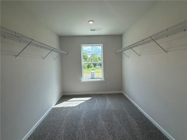 a view of a hallway with a window