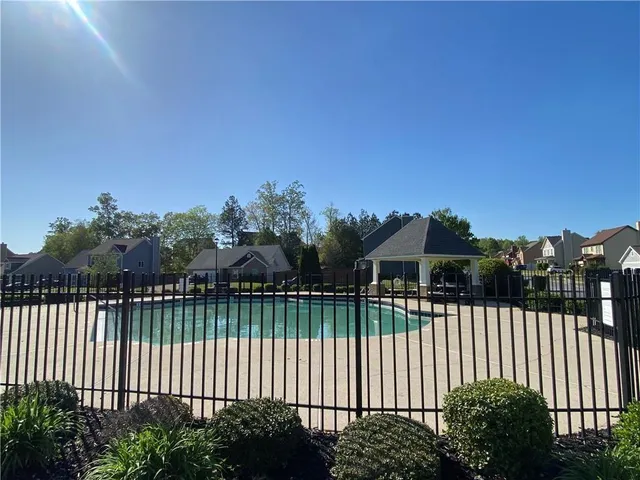 a view of a wrought iron fences in front of house