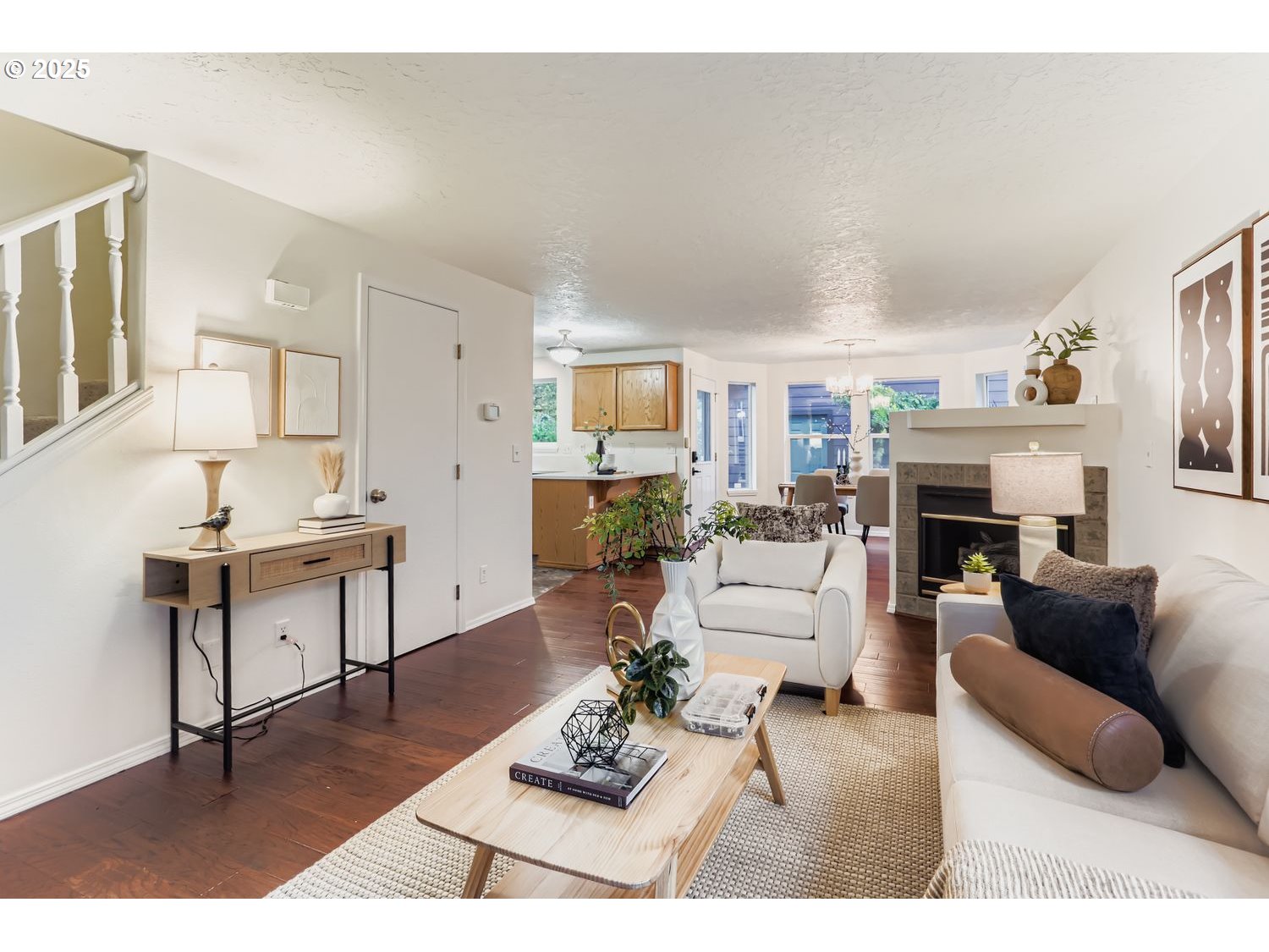 5626 North Williams Avenue Portland, OR 97217 - Photo 4 of 21 a living room with furniture a fireplace and a table