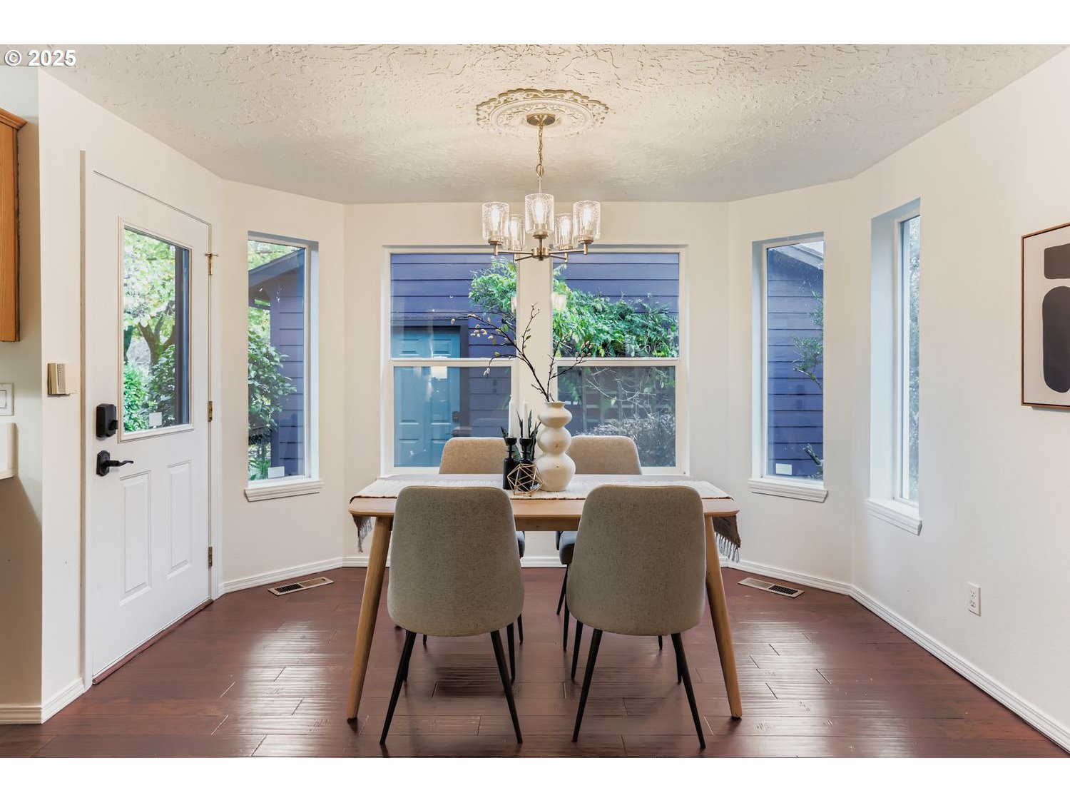 5626 North Williams Avenue Portland, OR 97217 - Photo 7 of 21 a view of a dining room with furniture wooden floor and windows