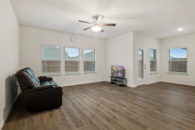 a living room with furniture and windows