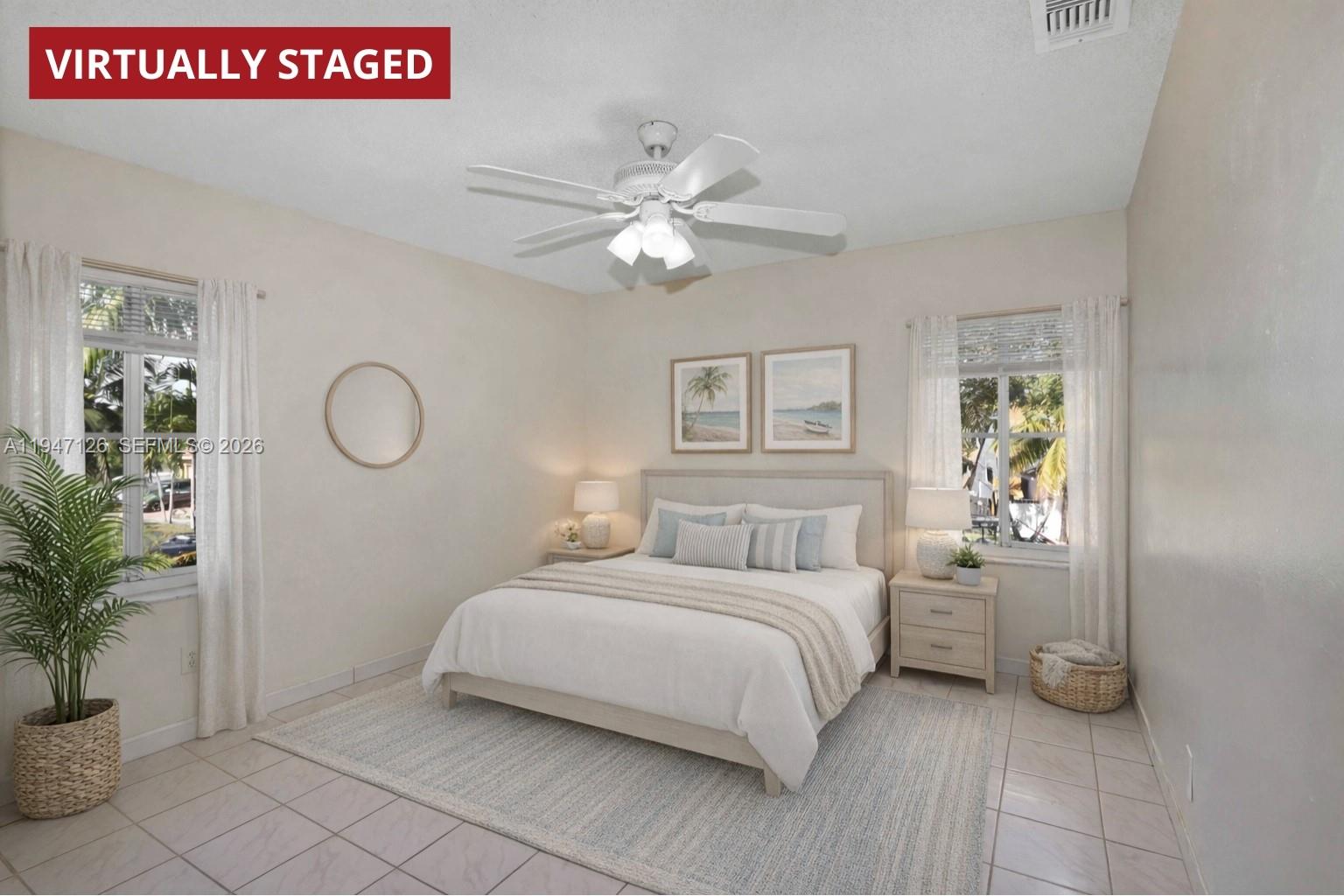 14826 Southwest 110th Terrace Miami, FL 33196 - Photo 20 of 40 a bedroom with a bed and a potted plant