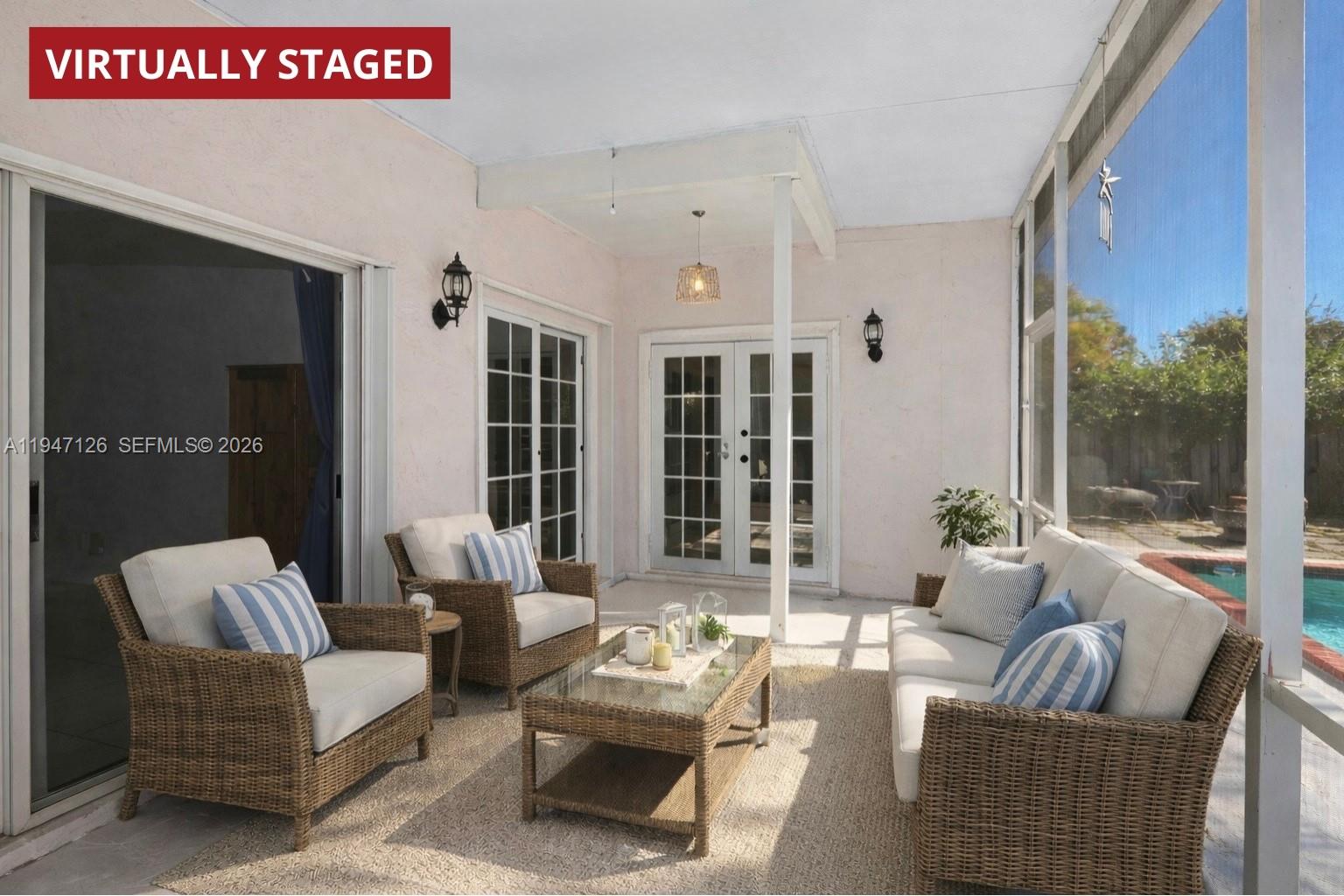 14826 Southwest 110th Terrace Miami, FL 33196 - Photo 25 of 40 a living room with furniture and large windows