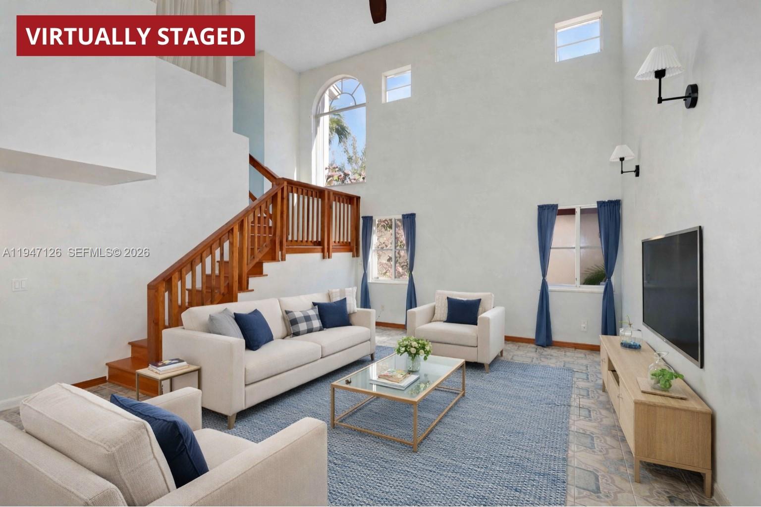 14826 Southwest 110th Terrace Miami, FL 33196 - Photo 3 of 40 a living room with furniture and a flat screen tv