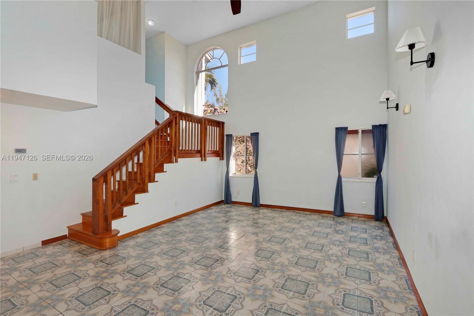 14826 Southwest 110th Terrace Miami, FL 33196 - Photo 4 of 40 a view of an entryway with stairs