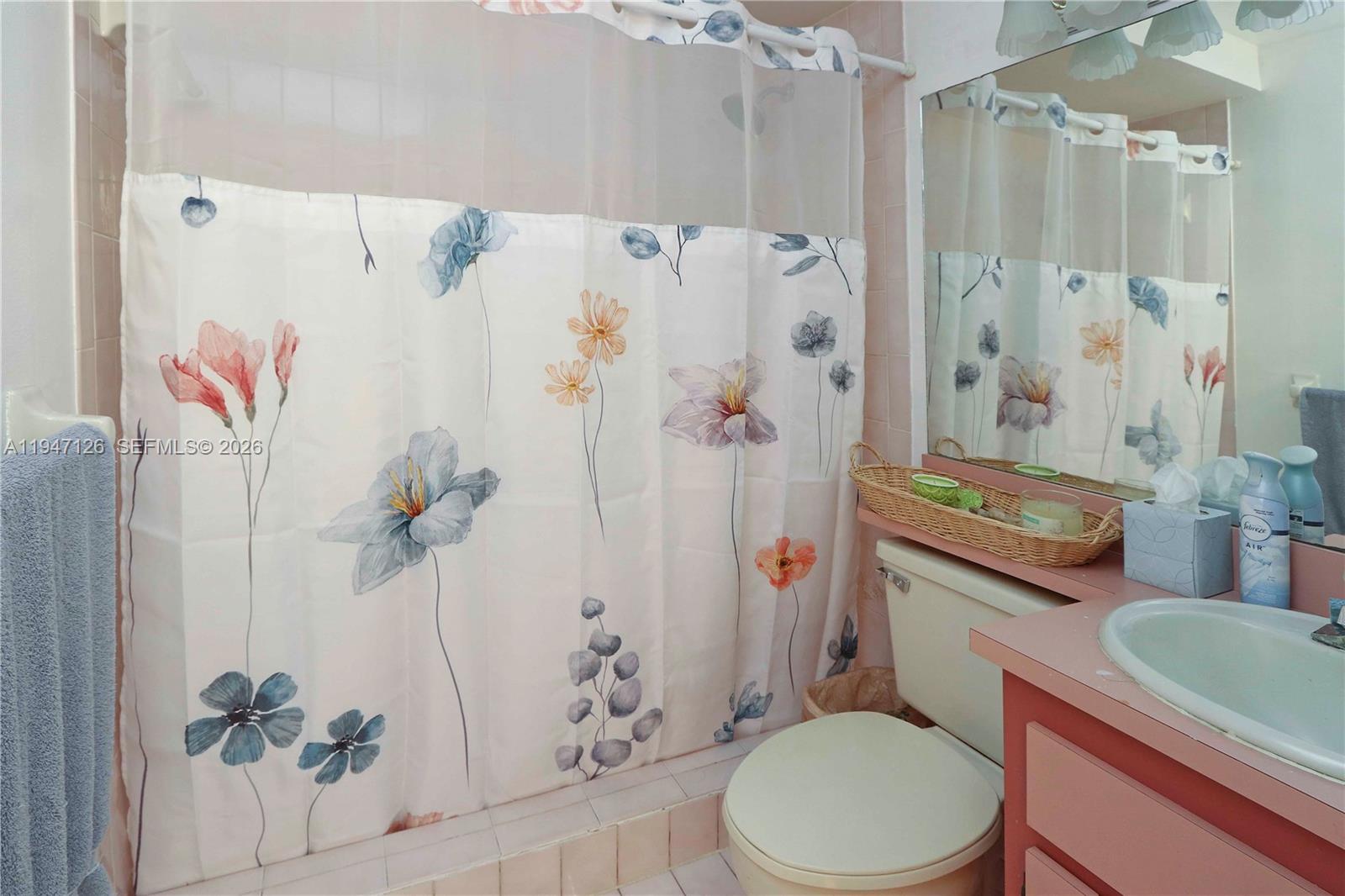 14826 Southwest 110th Terrace Miami, FL 33196 - Photo 6 of 40 a white toilet sitting next to a bathroom sink