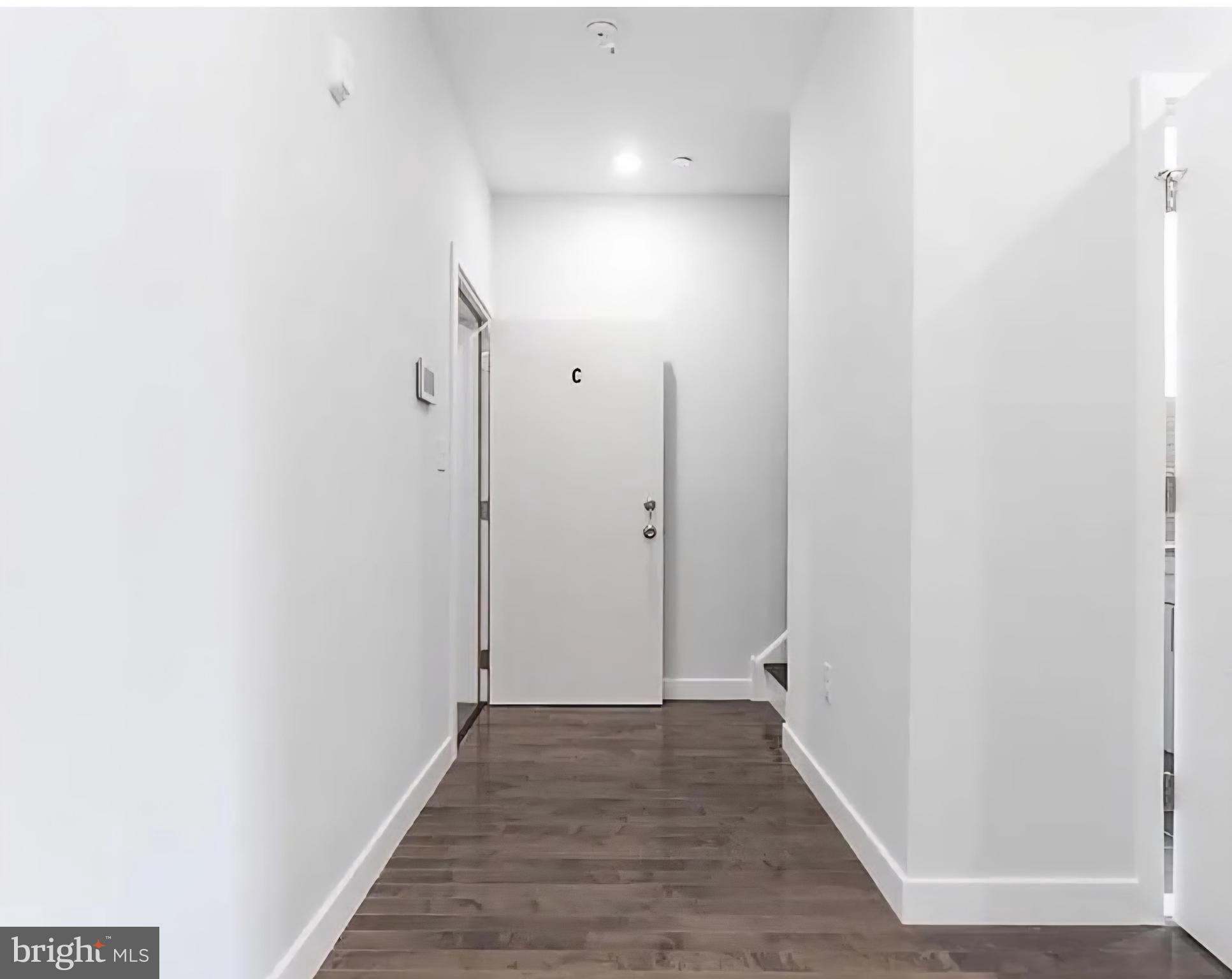 1945 North 7th Street, Unit 3 Philadelphia, PA 19122 - Photo 11 of 22 a view of a hallway with wooden floor