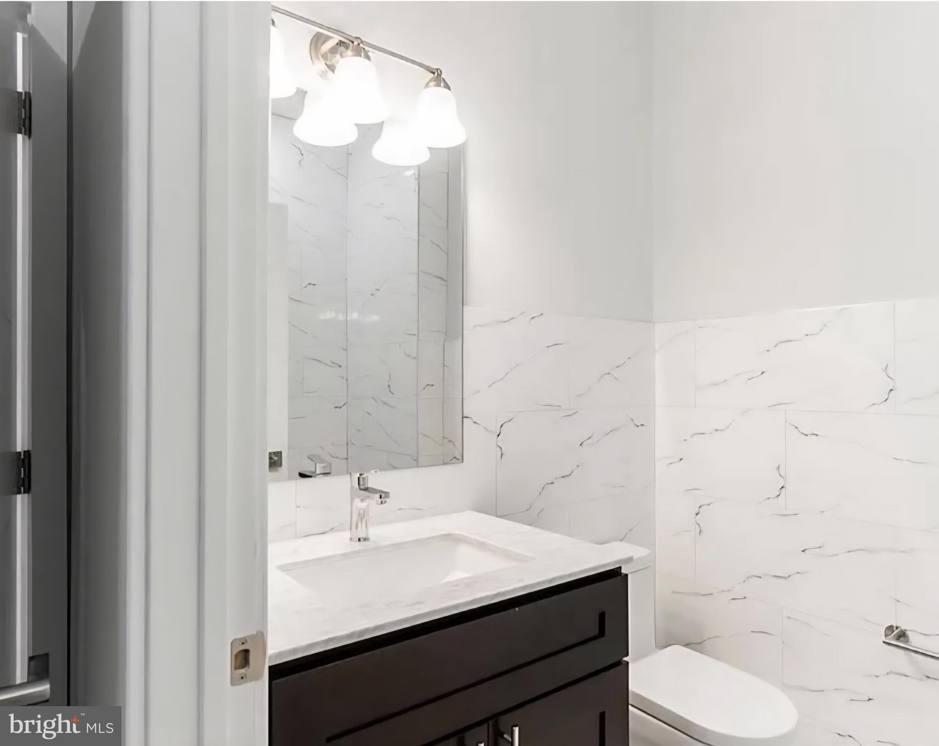 1945 North 7th Street, Unit 3 Philadelphia, PA 19122 - Photo 13 of 22 a bathroom with a sink toilet and shower