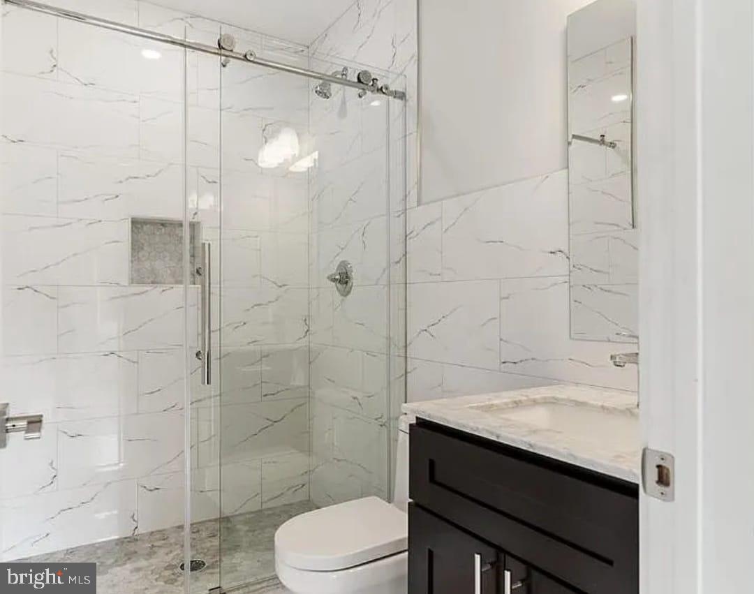 1945 North 7th Street, Unit 3 Philadelphia, PA 19122 - Photo 16 of 22 a bathroom with a sink a toilet and shower