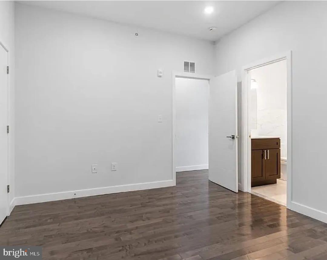 1945 North 7th Street, Unit 3 Philadelphia, PA 19122 - Photo 17 of 22 a view of an empty room with wooden floor