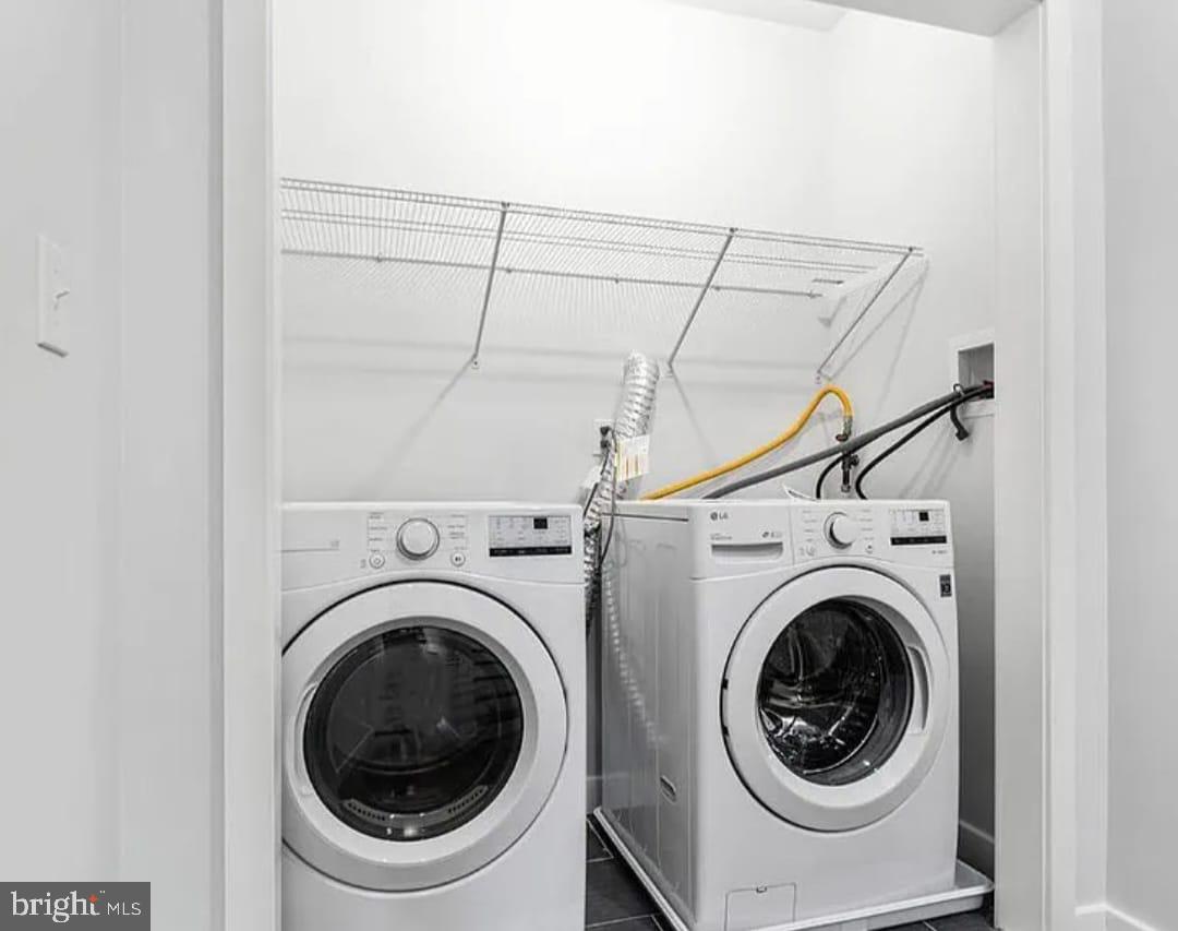 1945 North 7th Street, Unit 3 Philadelphia, PA 19122 - Photo 22 of 22 a view of a hallway with washer and dryer