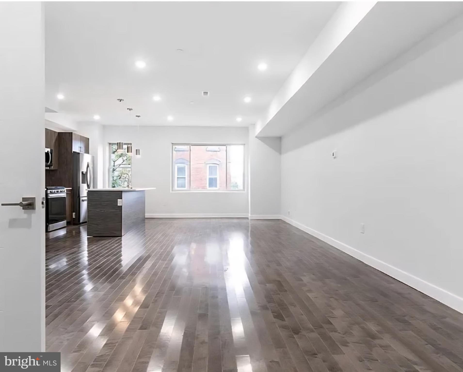 1945 North 7th Street, Unit 3 Philadelphia, PA 19122 - Photo 5 of 22 a view of a kitchen with a sink and refrigerator