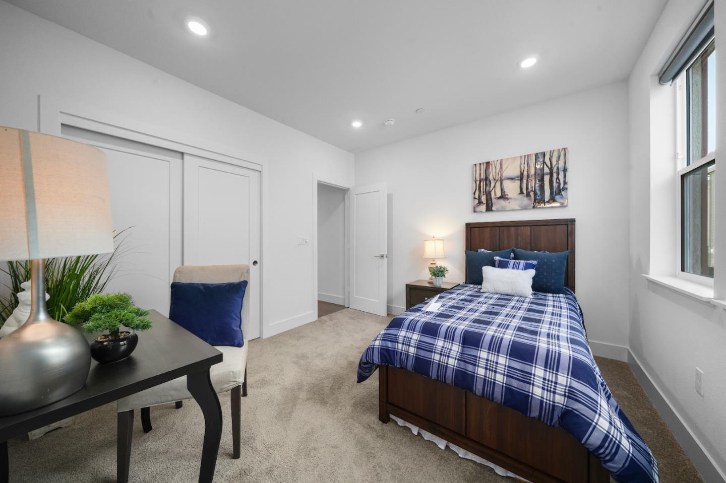 3029 Lamory Place Santa Clara, CA 95051 - Photo 13 of 25 a bedroom with a large bed and a potted plant