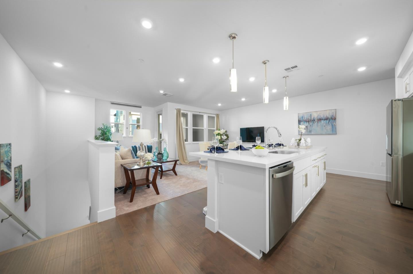 3029 Lamory Place Santa Clara, CA 95051 - Photo 6 of 25 a large white kitchen with lots of counter space a sink appliances and a living room view