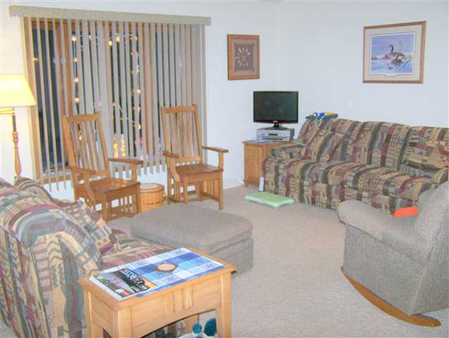984 Winborne Road Davis, IL 61019 - Photo 3 of 9 a living room with furniture and a flat screen tv