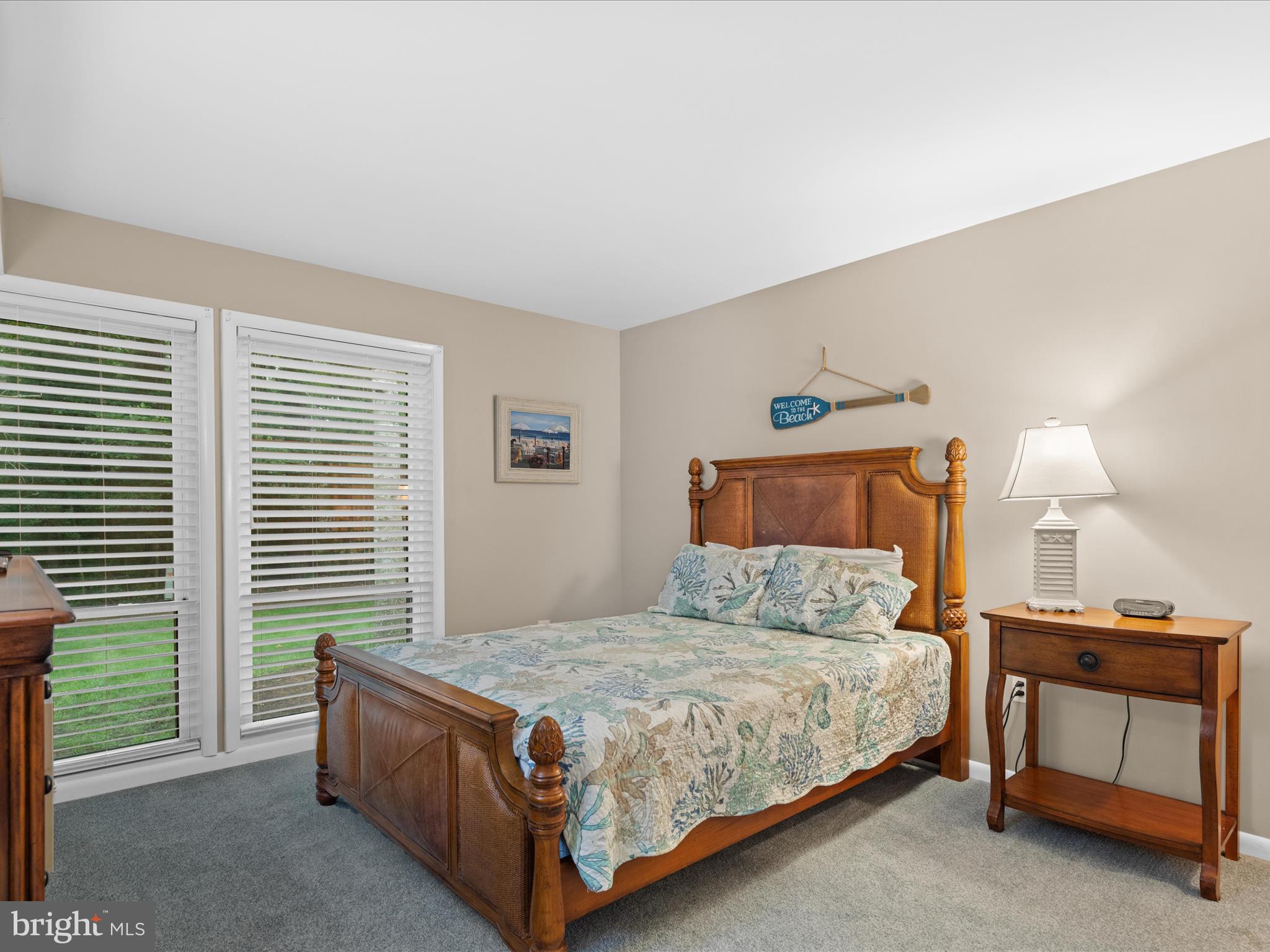 39346 Racquet Lane, Unit 8504 Bethany Beach, DE 19930 - Photo 25 of 40 a bedroom with a bed and a window