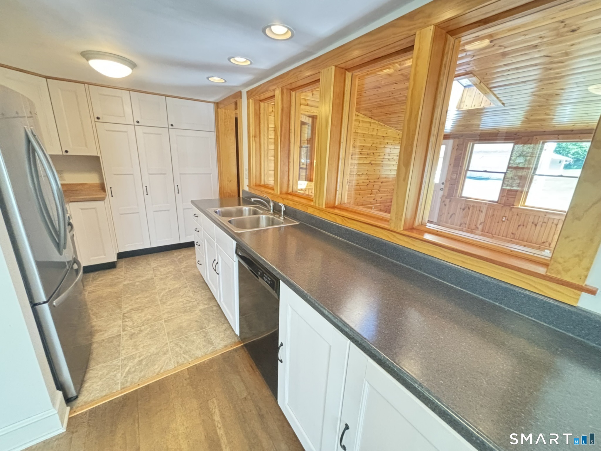 44 Summit Road Prospect, CT 06712 - Photo 10 of 40 a view of a kitchen with stainless steel appliances granite countertop a sink and a large window