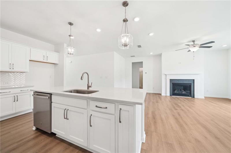 320 Silverleaf Trail Bethlehem, GA 30620 - Photo 11 of 36 a kitchen with kitchen island a sink stainless steel appliances and cabinets